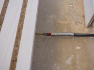 Fix the floor rail to the 25 mm MDF batten